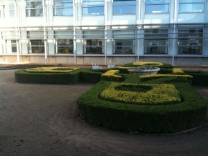 The OU logo in hedges